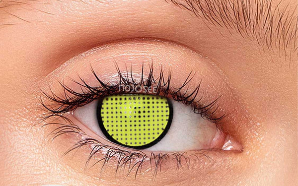 Yellow mesh contact lens on an open eye