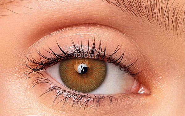 Natural hazel contact lens on an open eye