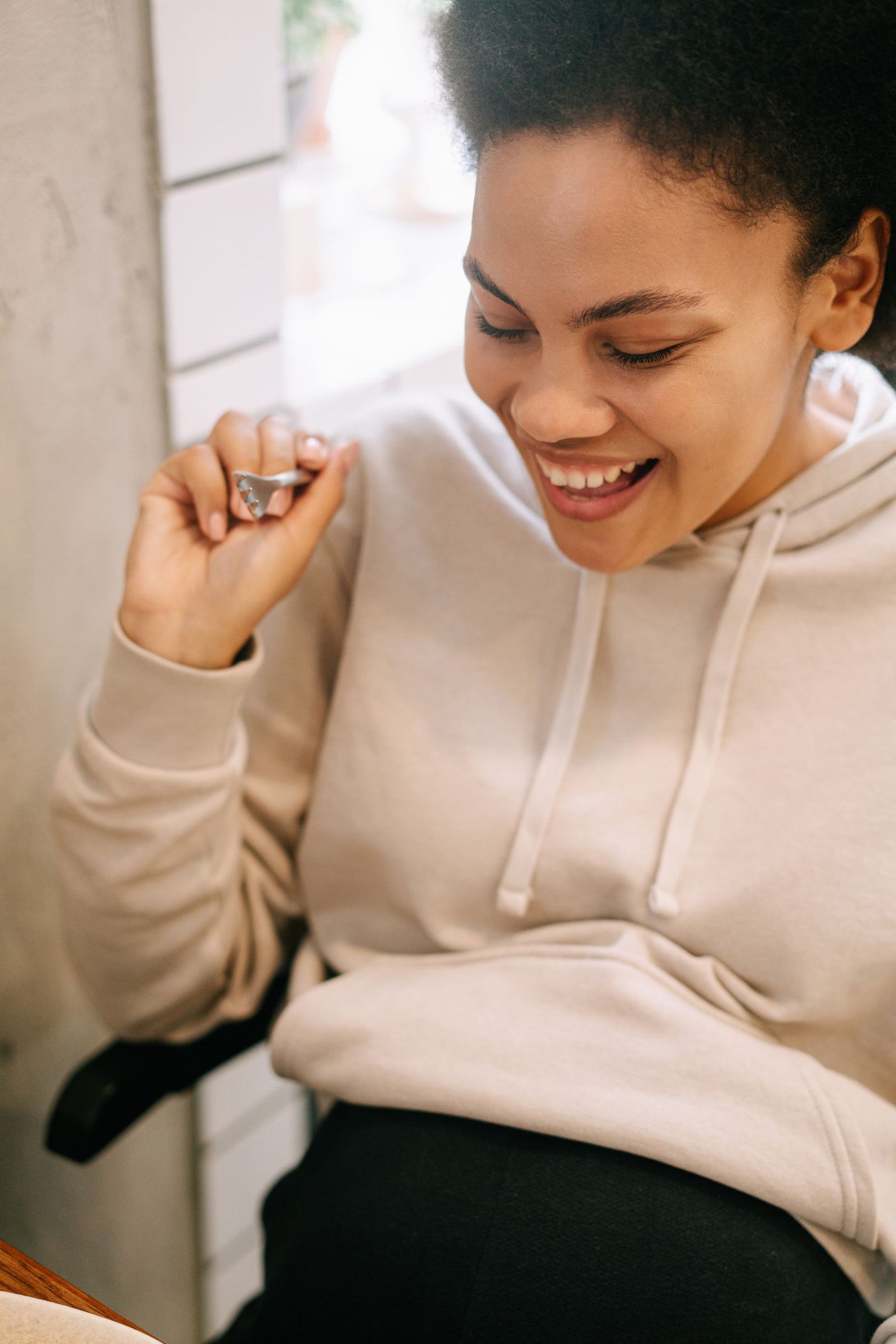 Smiling pregnant woman in a casual home setting
