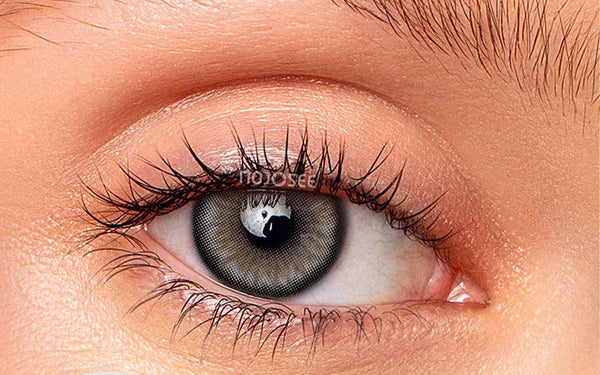 Natural gray contact lens on an open eye
