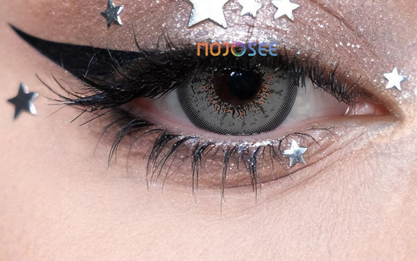 Grey contact lens and silver star eye makeup, photographed close-up; Mojosee watermark retained.