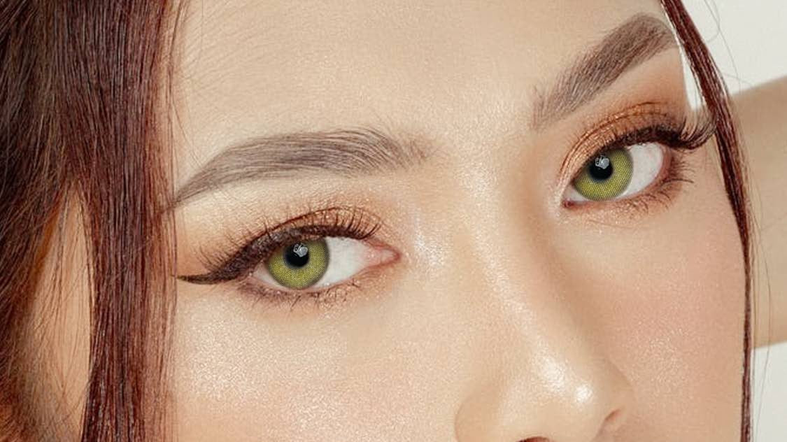 Warm hazel-green colored contacts, natural editorial portrait