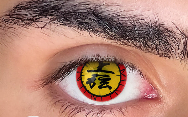 Red and yellow patterned cosplay lens on an open eye