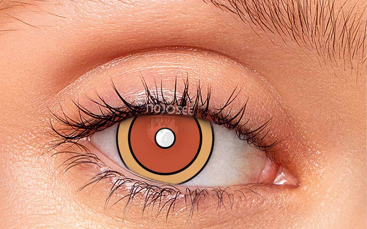 Orange patterned cosplay contact lens on an open eye