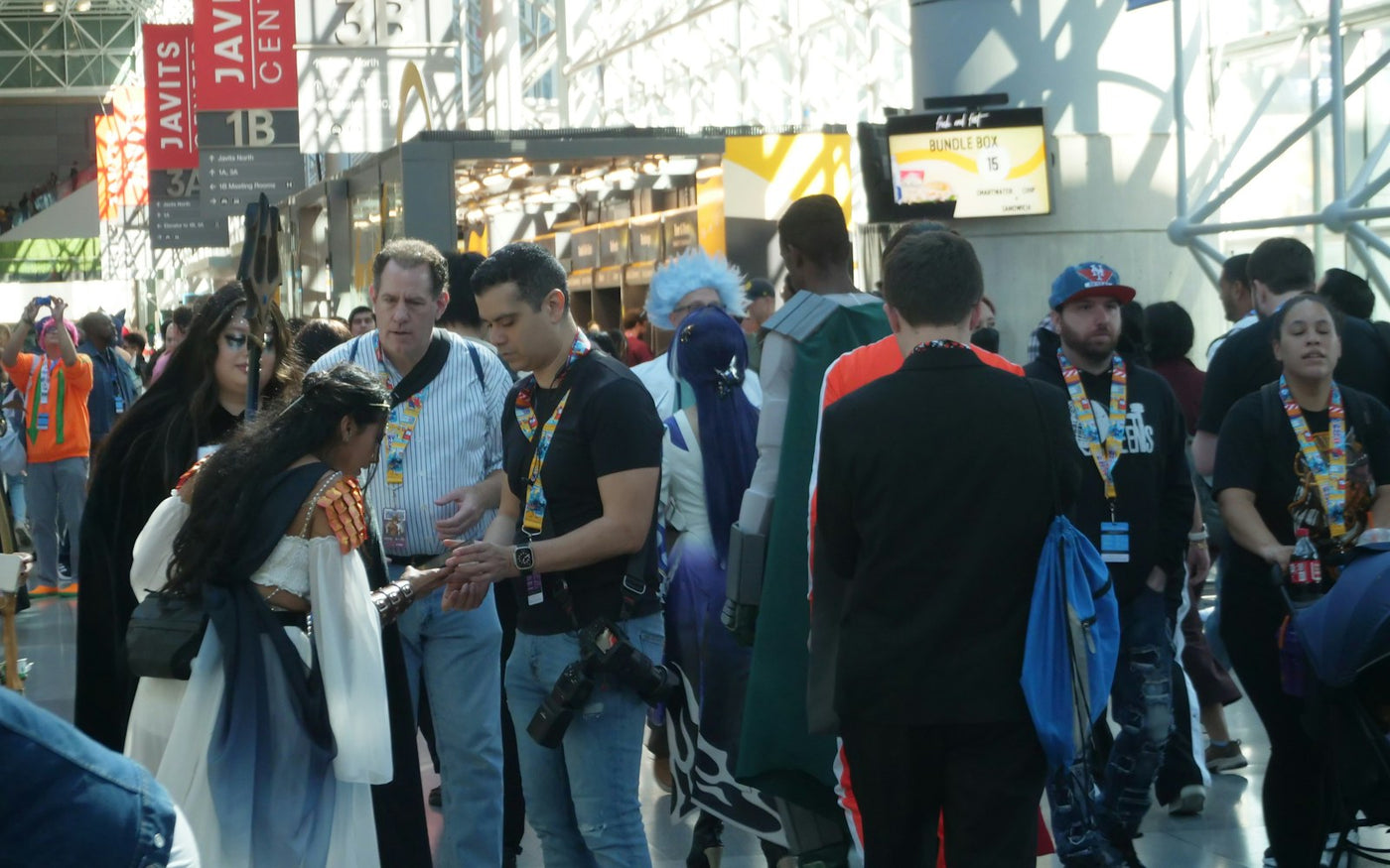 crowded comic convention hall full of cosplayers