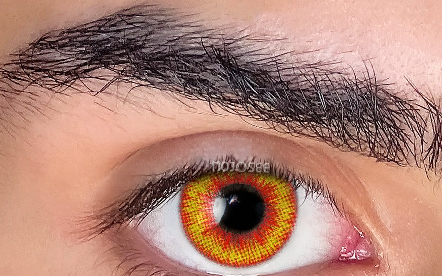 Fire amber wolf-eye lens worn on a wide-open eye