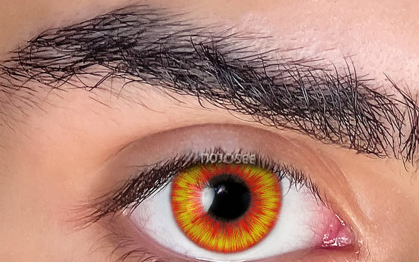 Fire amber wolf-eye lens worn on a wide-open eye