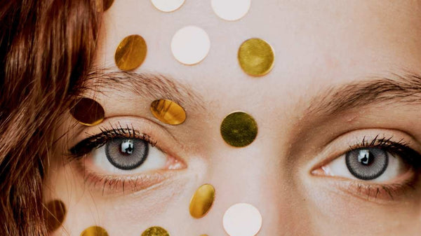 Gray colored contacts, editorial beauty look with gold confetti
