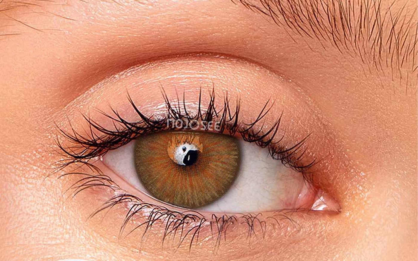 Natural hazel contact lens on an open eye
