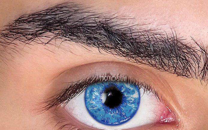 Bright sky-blue Six Eyes lens worn on a real eye