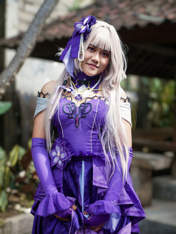 Woman in an elegant purple anime cosplay costume outdoors