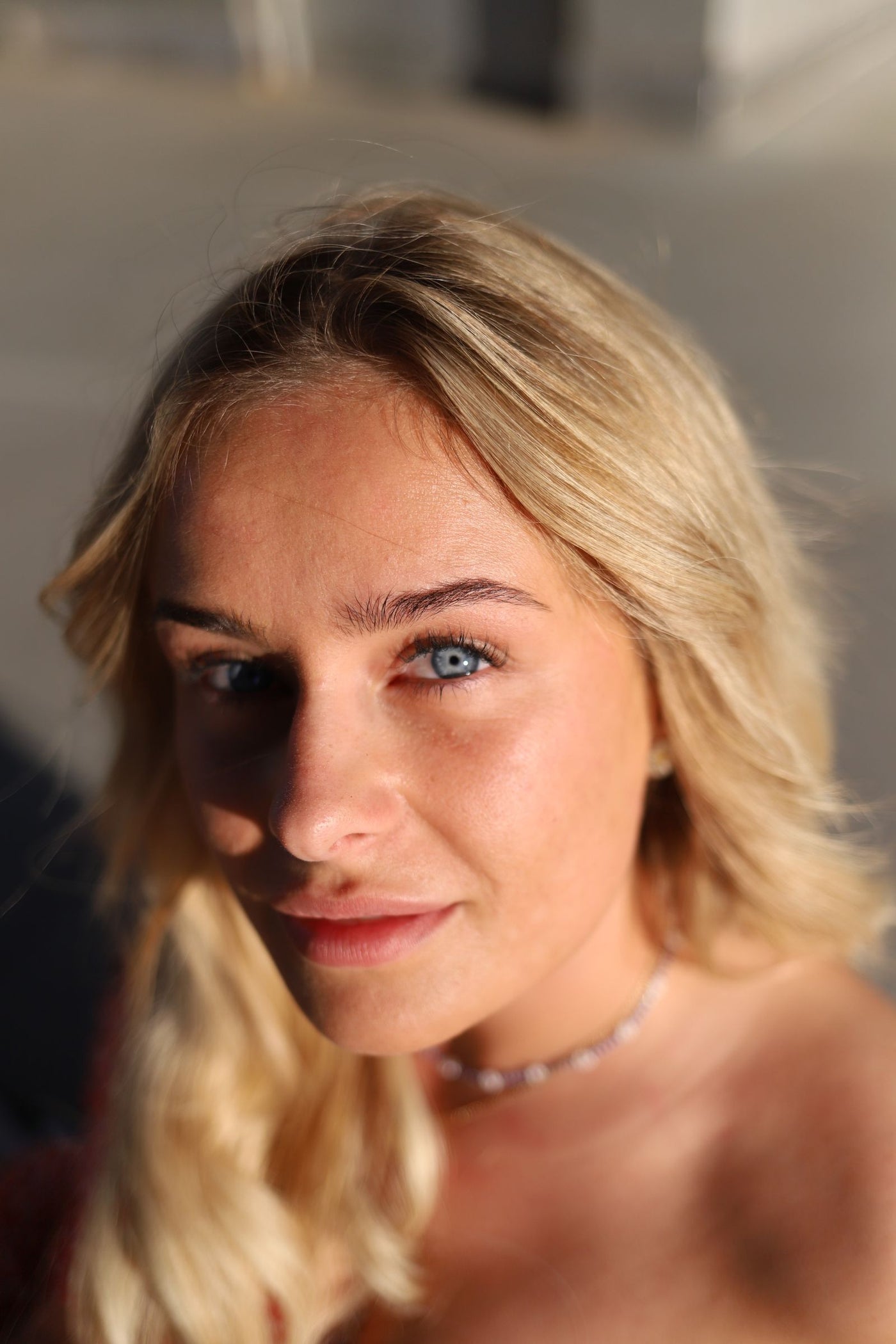 Blonde woman with light eyes, showing hair and eye color pairing