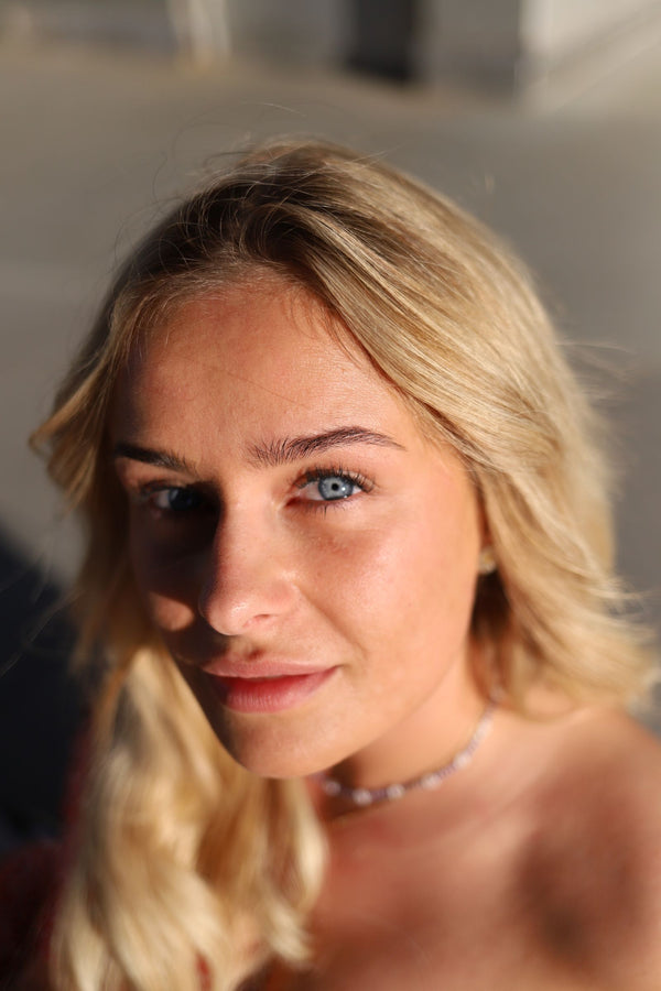 Blonde woman with light eyes, showing hair and eye color pairing