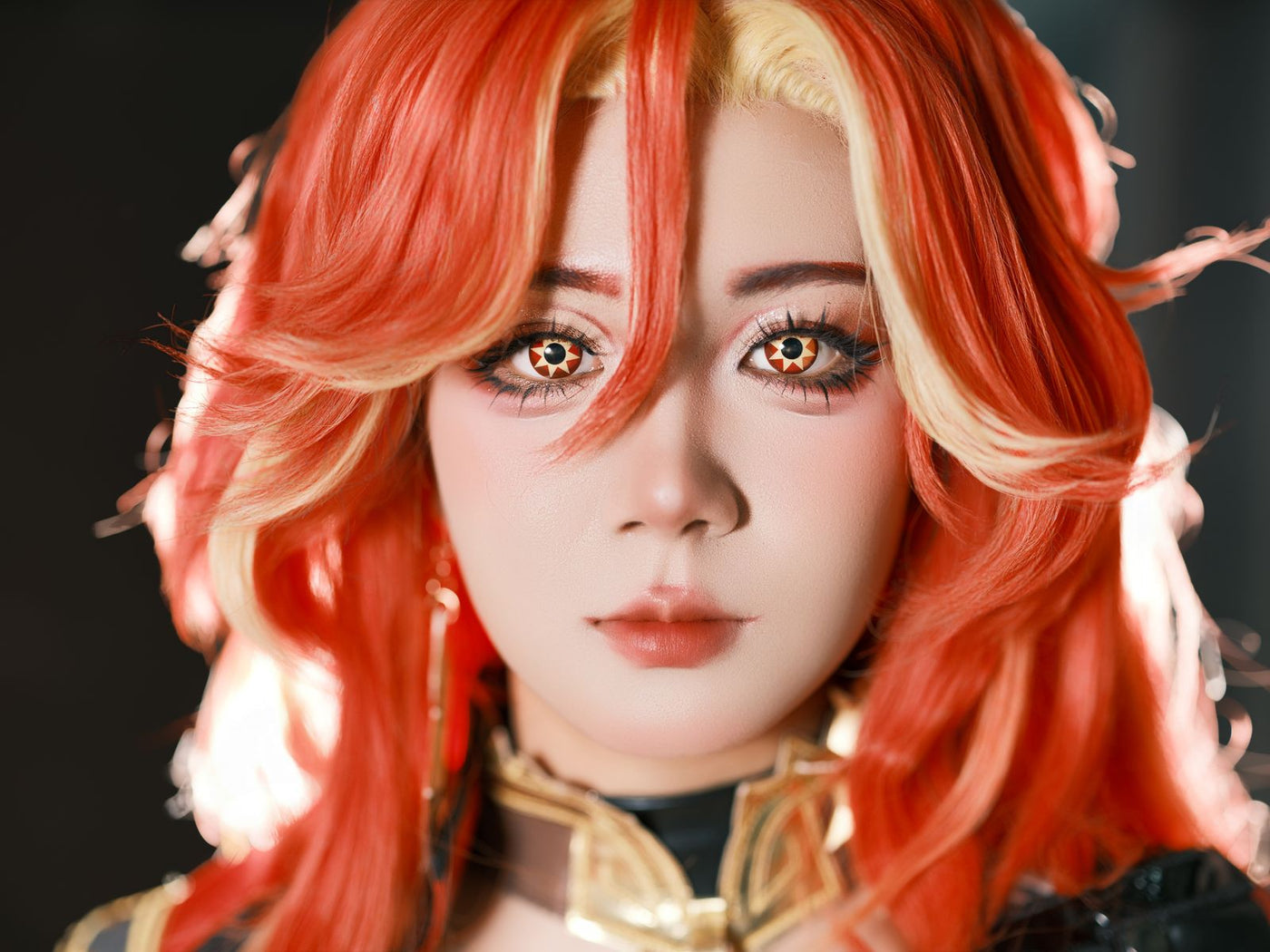 Cosplayer wearing orange starburst cosplay contacts with detailed eye makeup