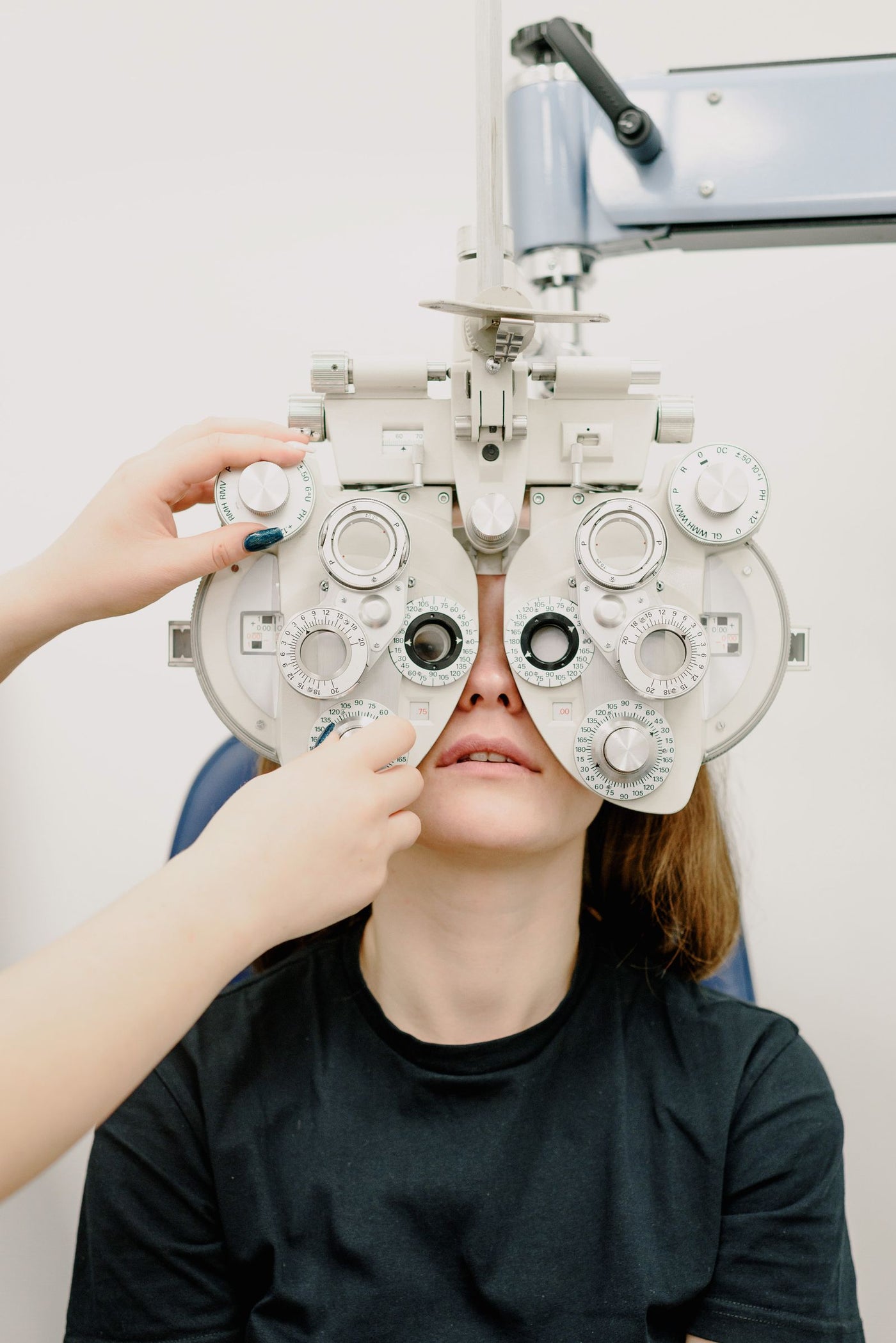 Ophthalmologist using professional phoropter equipment