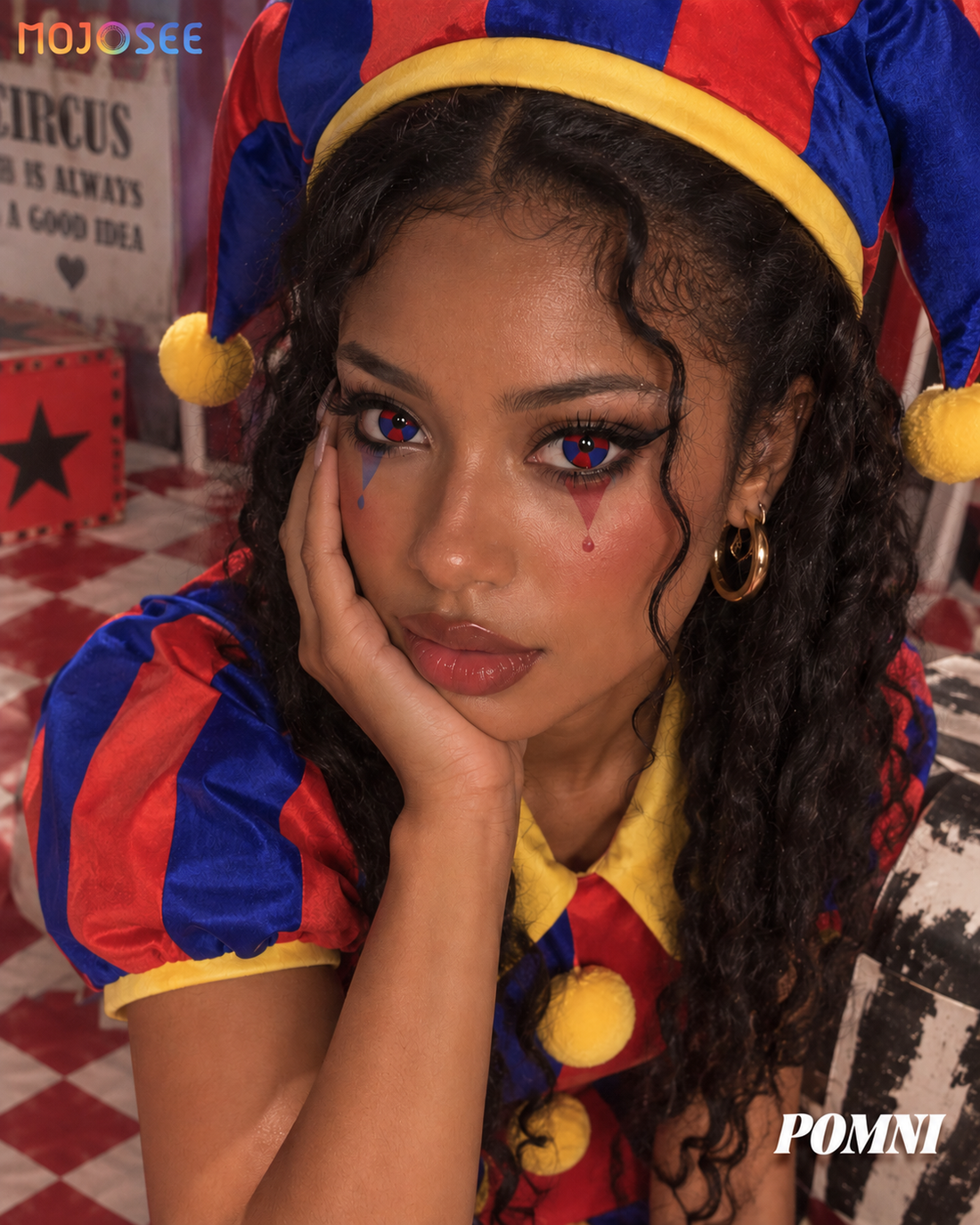 Pomni cosplay on deep skin tone with red and blue pinwheel contact lenses